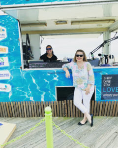 Woman standing in front of booth