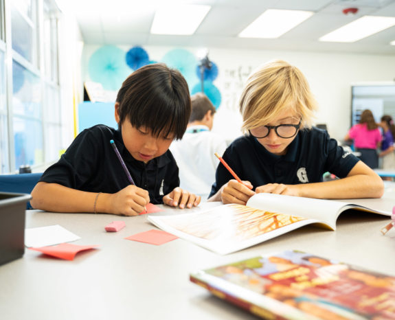 Lower school students reading and writing