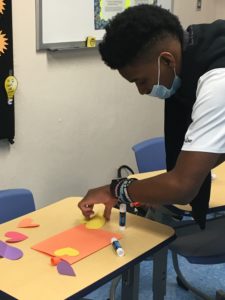 student making a card