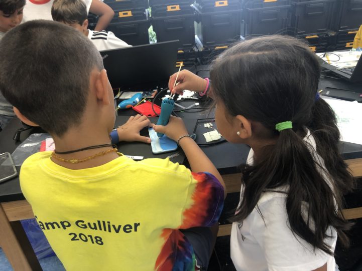 Two students working together on an engineering project