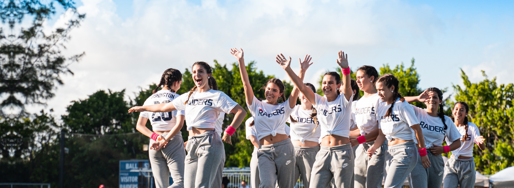 Female athletes cheering