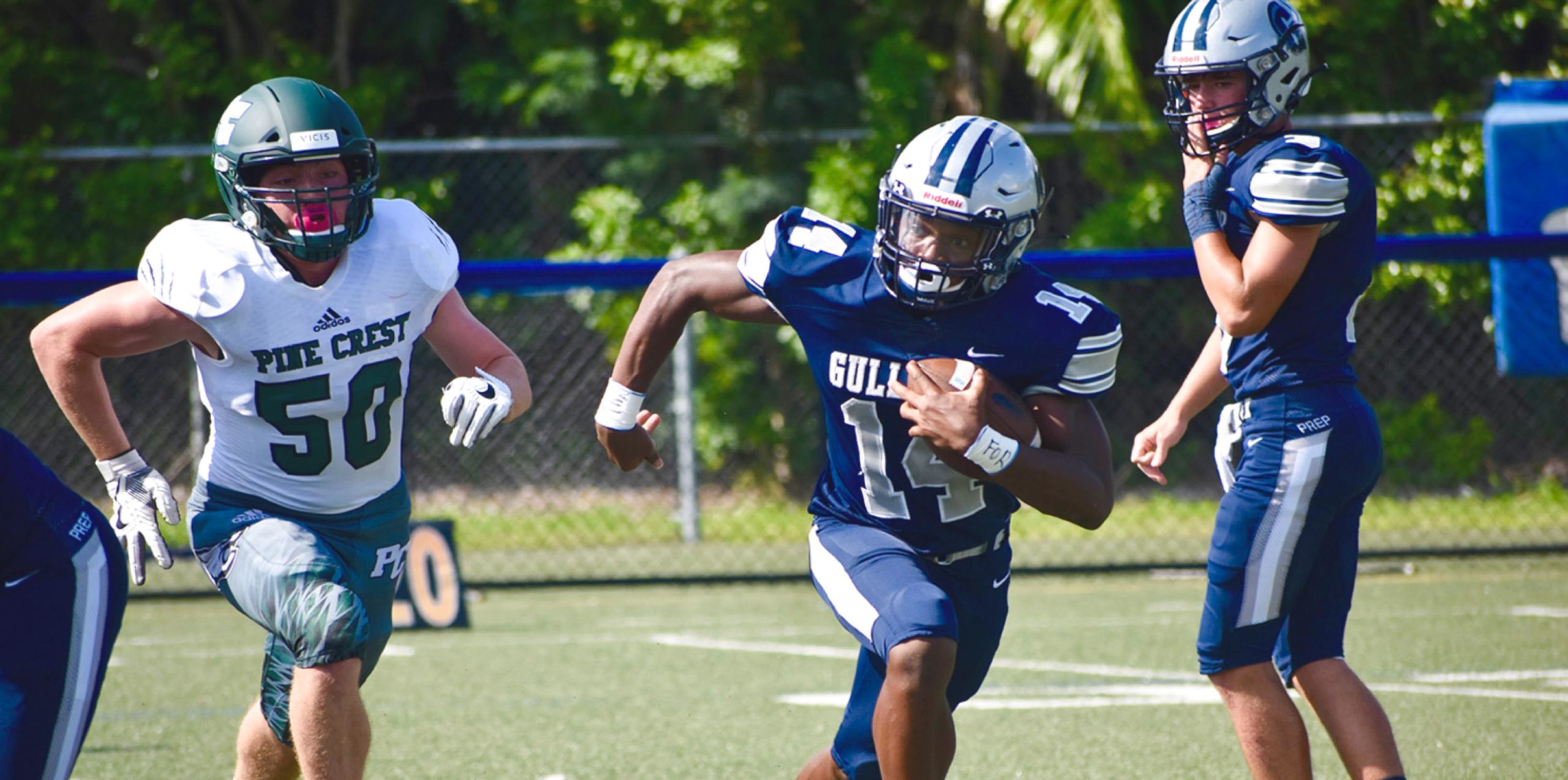 Football players running during a game