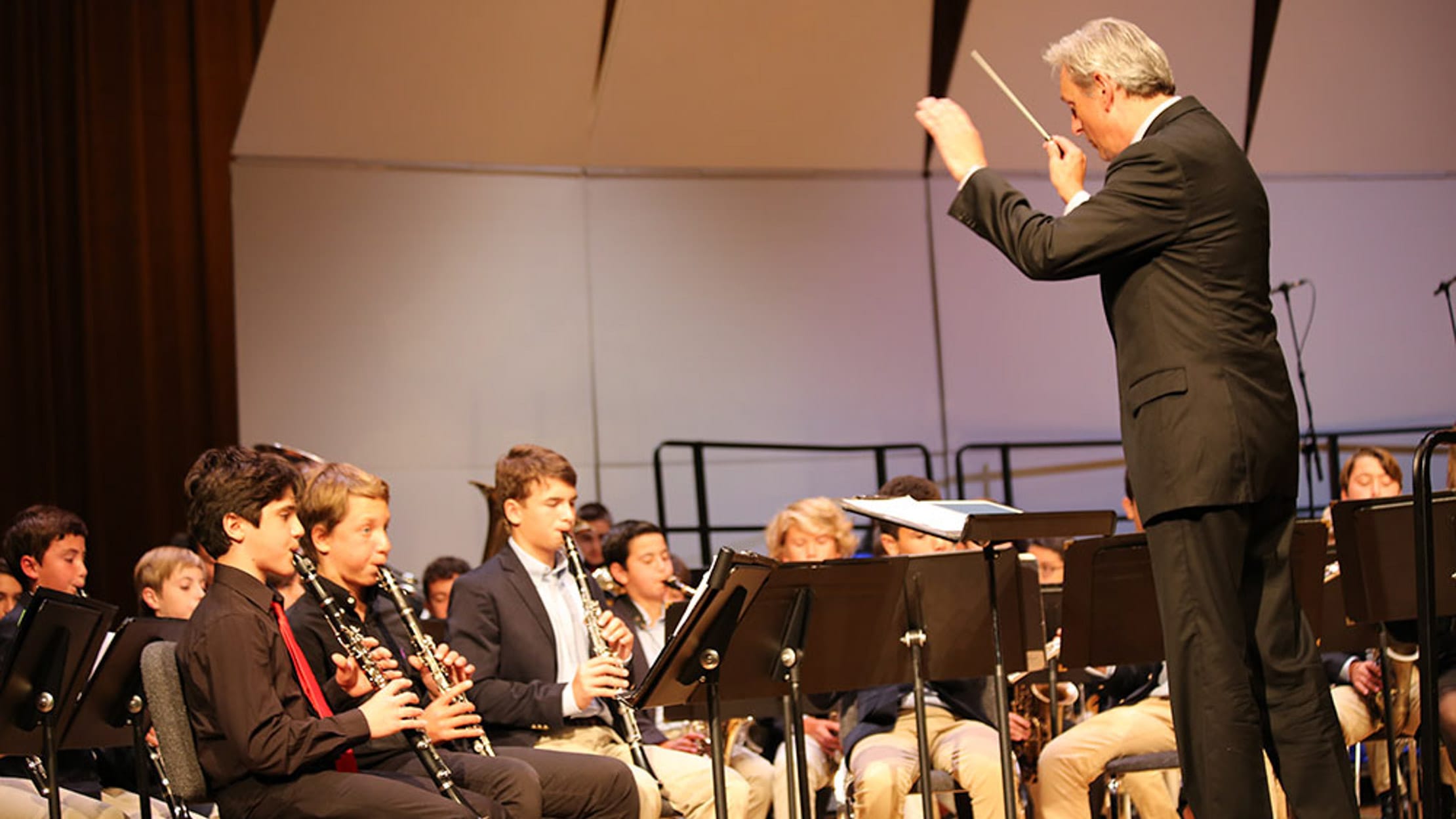 Students in grades 5-8 playing music