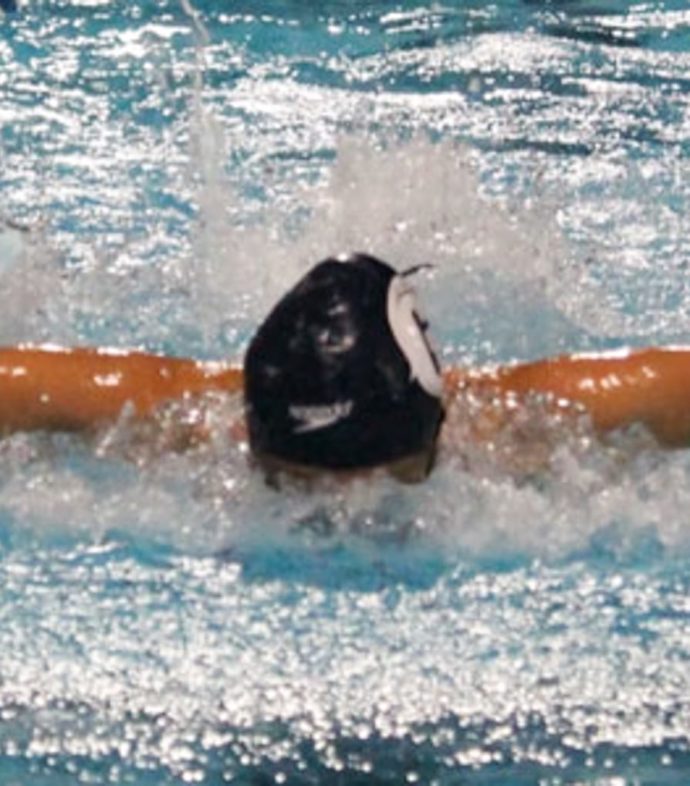 Female swimming in a pool