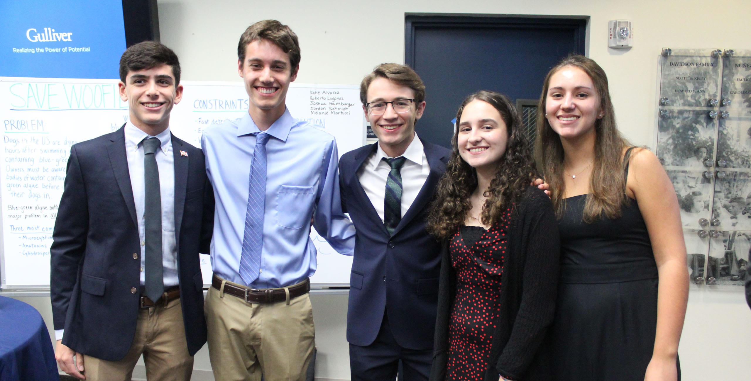 Five International Diplomacy & Law students standing in formal attire