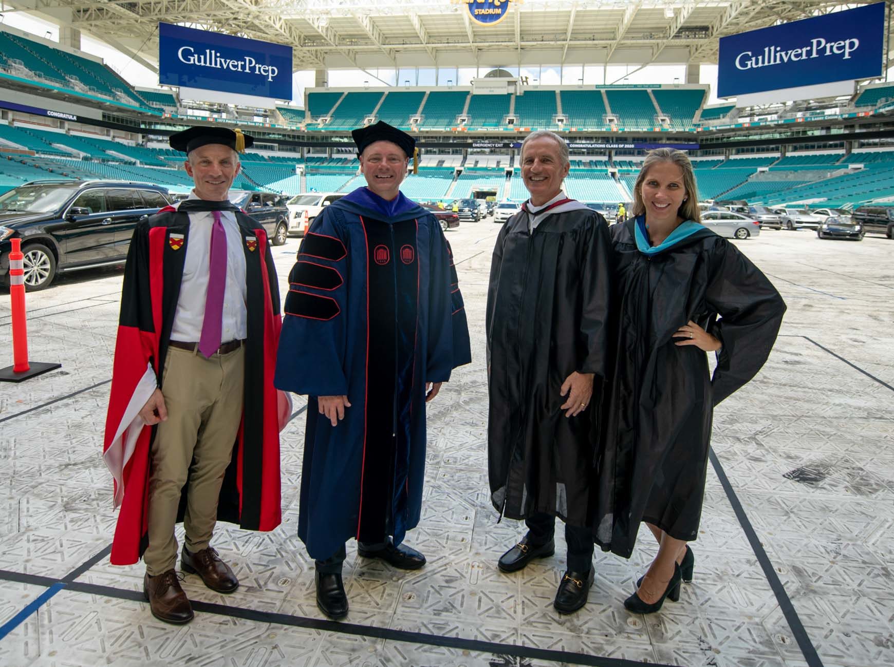 Four members of the Gulliver leadership team standing in the graduation venue