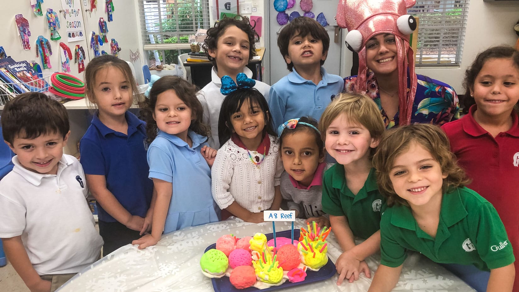 Lower school kids in biology class smiling