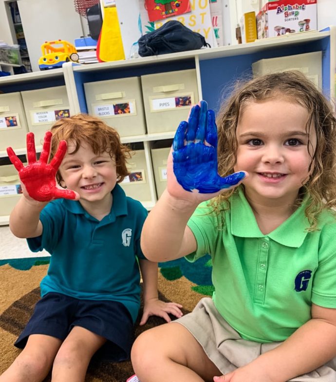 two kids with painted hands