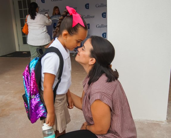 Mother and daughter touching noses