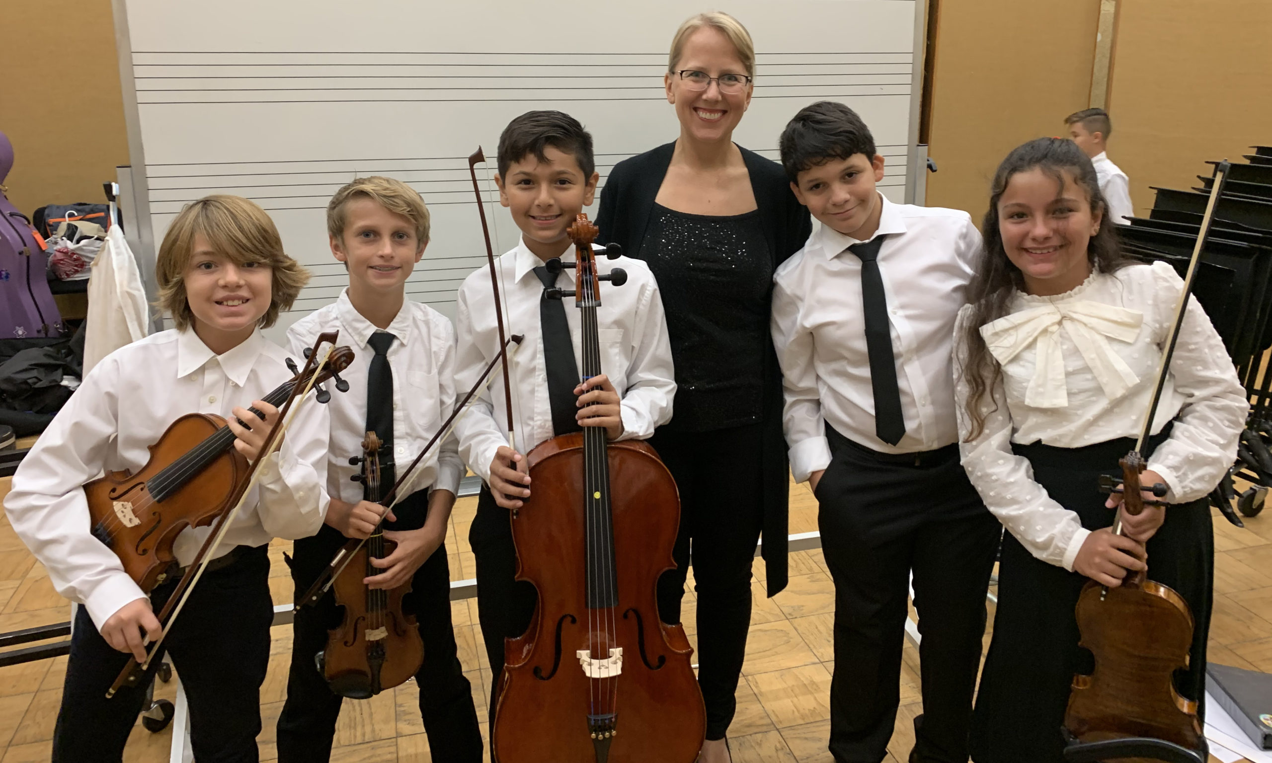 Members of the Academy Orchestra with their teacher