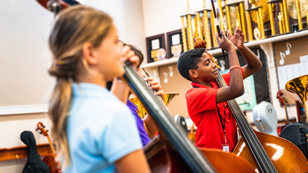 two students in music class