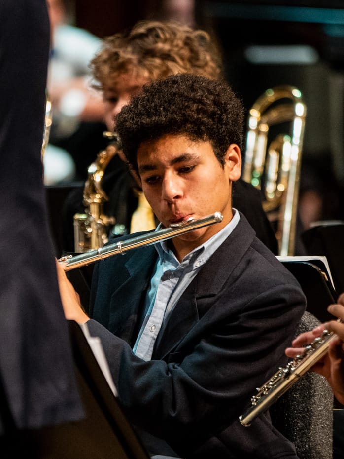 Upper school student playing an instrument