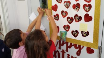 Young students in class celebrating Random Acts of Kindness Week
