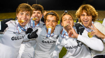 Boys' Soccer Team with medals at State Championship