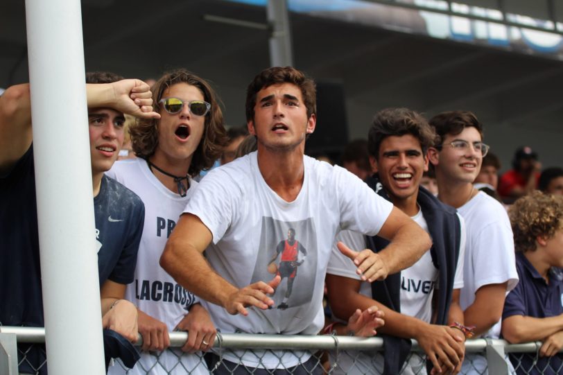 Upper students cheering during a sports game