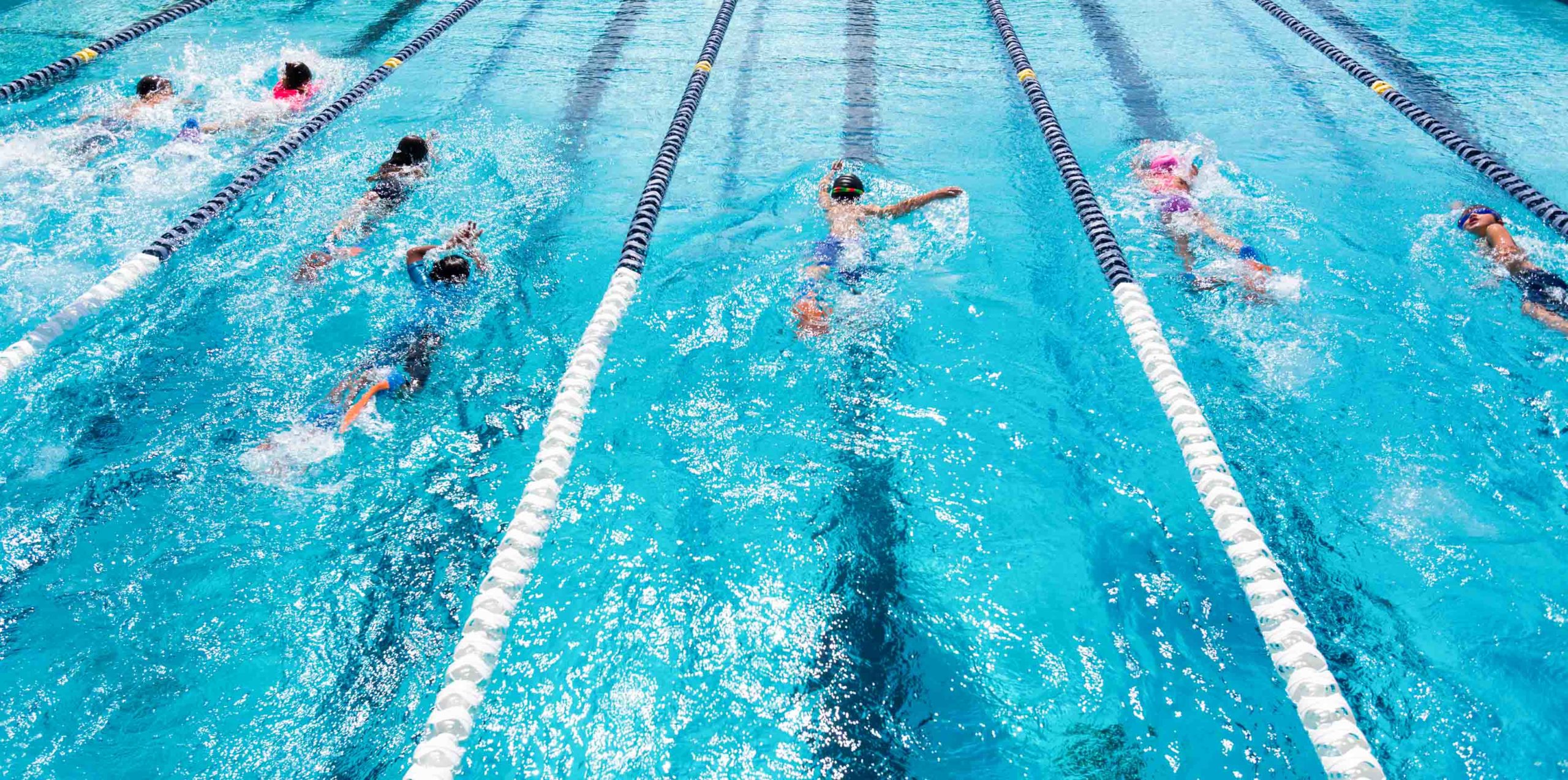 Middle school students swimming in lanes