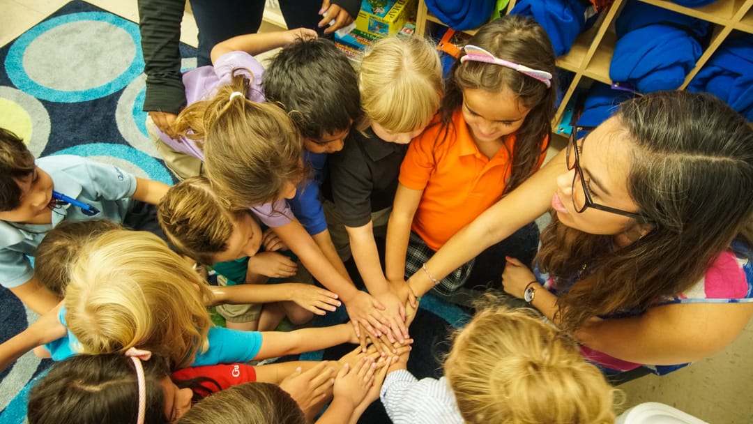 Lower school doing a team huddle