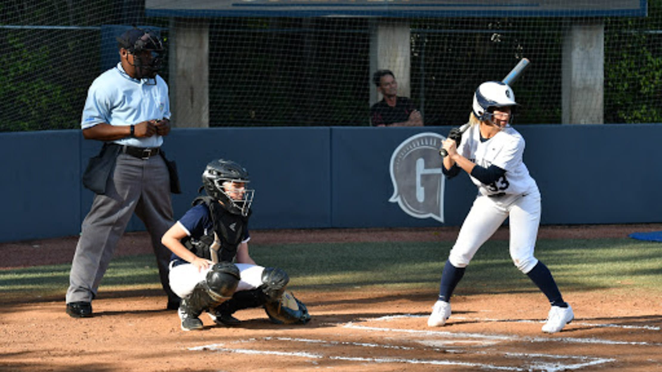 Two girls playing softball