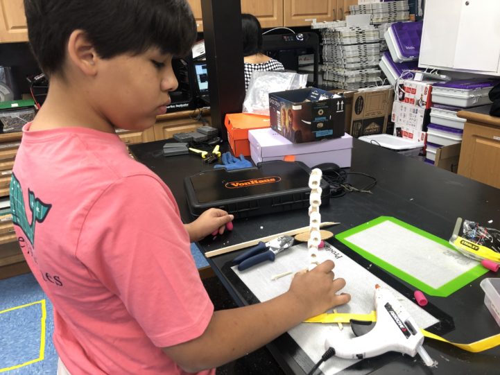 Child doing an engineering project.