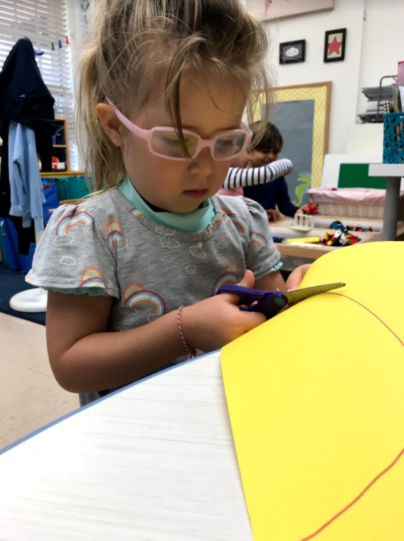 Young child doing an art project.