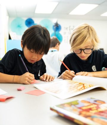 Middle school students working on an assigment