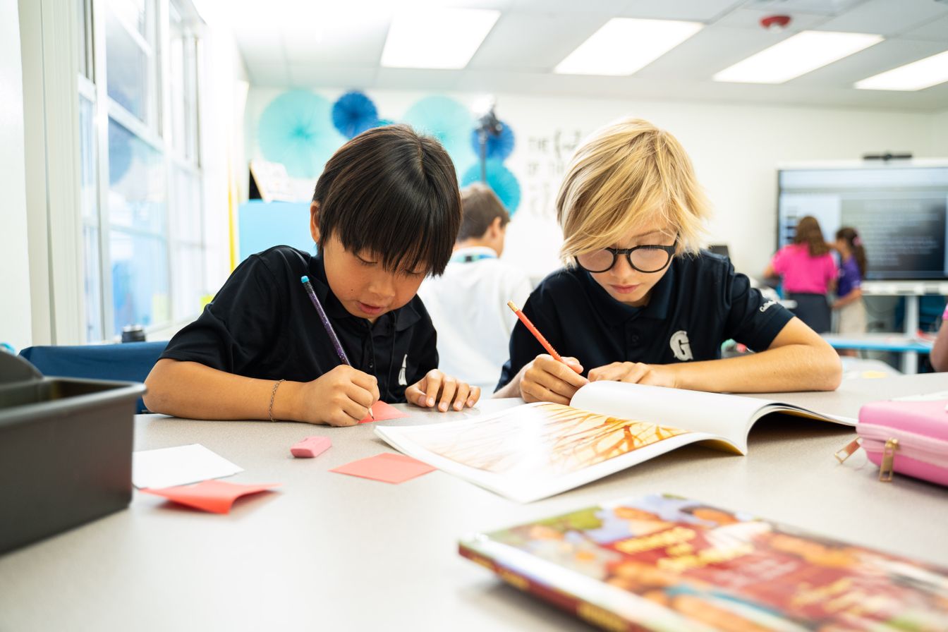 Two male middle school students working on an assignment