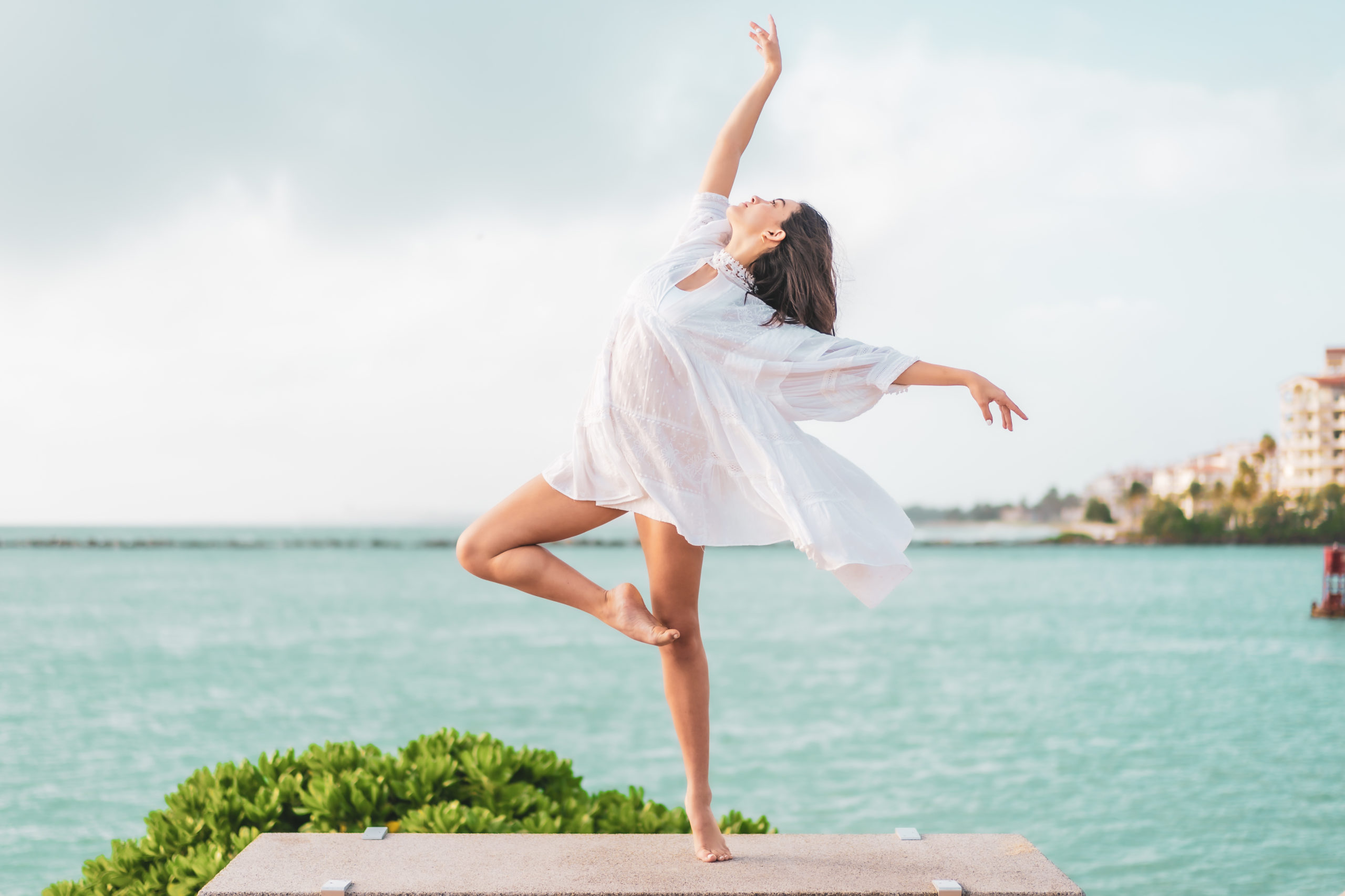 Dancer posing by the ocean