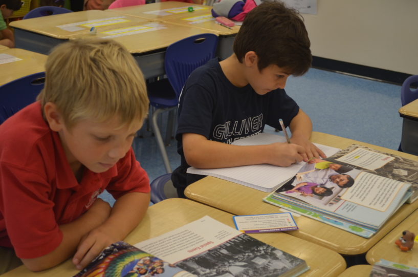 Students complete a reading activity in class.