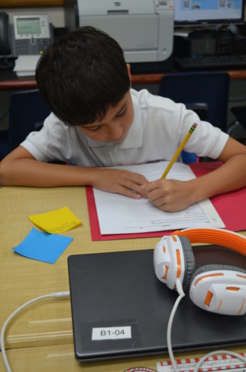 Student completing a writing assignment.