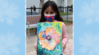 Student with artwork.