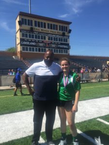 Chichi Nwadike '96 with Gulliver soccer player