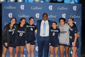 Chichi Nwadike '96 with the girls soccer team