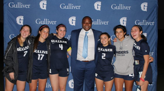 Chichi Nwadike '96 with the girls soccer team