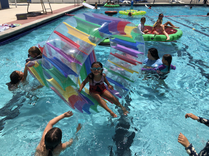 Young girl on pool float