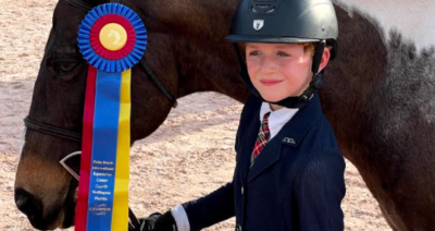 young child with horse at competition