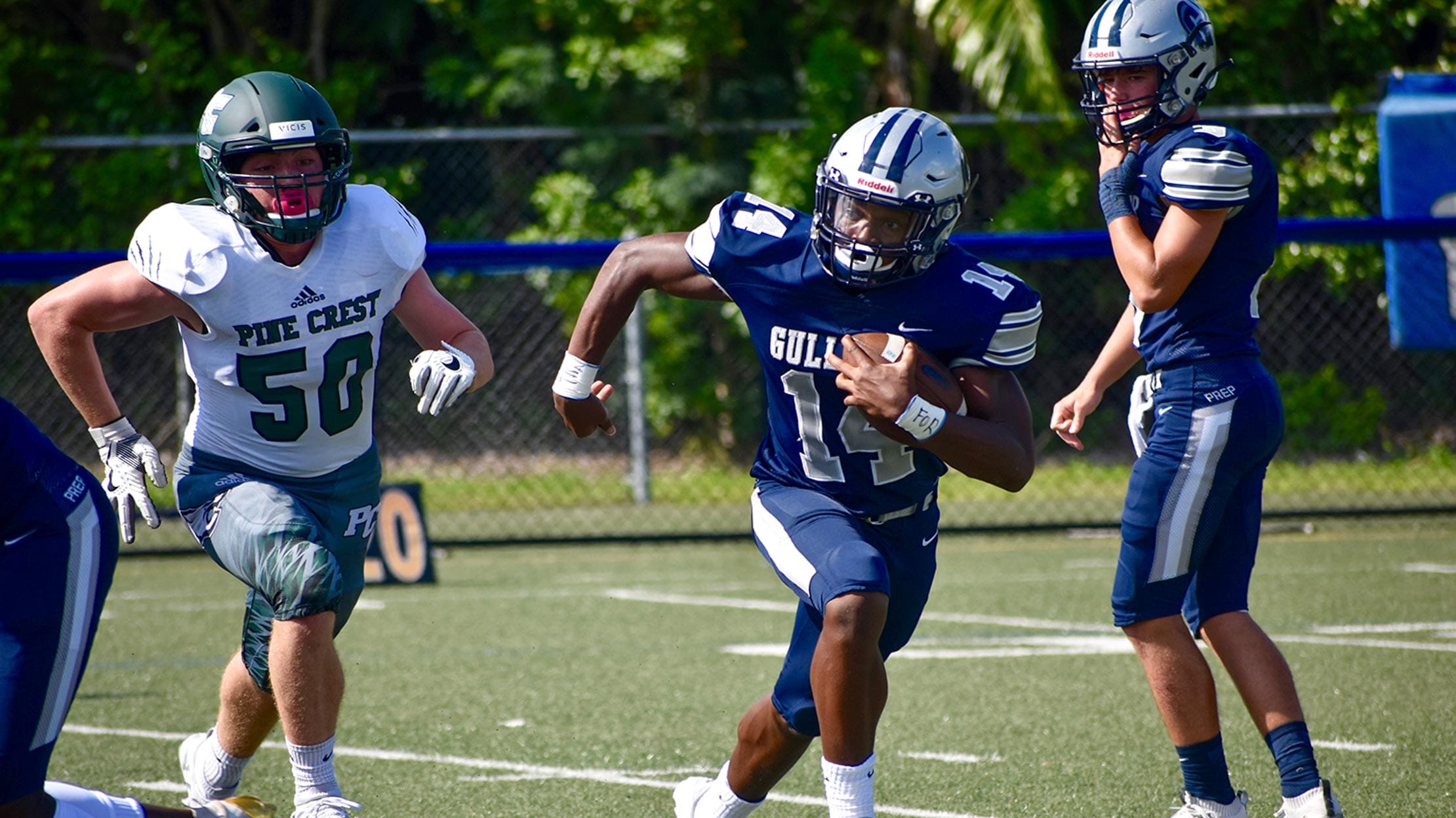 Gulliver football player running during a game.