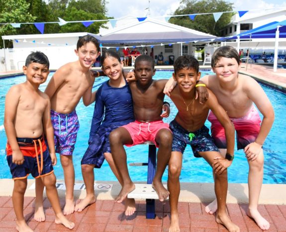 Camp Gulliver Campers posing together next to a pool