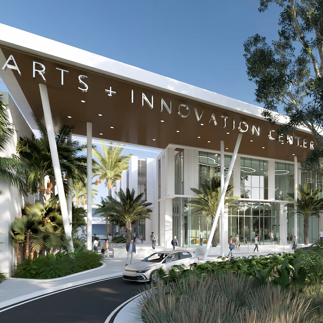 Modern building labeled “Arts + Innovation Center” with glass facade, surrounded by palm trees, landscaped greenery, and people walking near a circular driveway.
