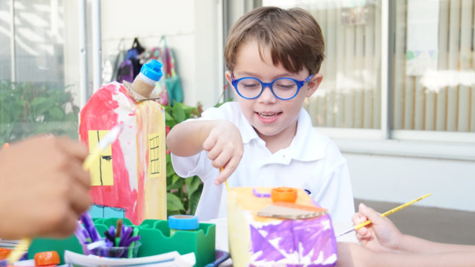 A Lower School student working on an art project