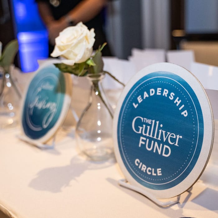 Giving circle plaques at an event