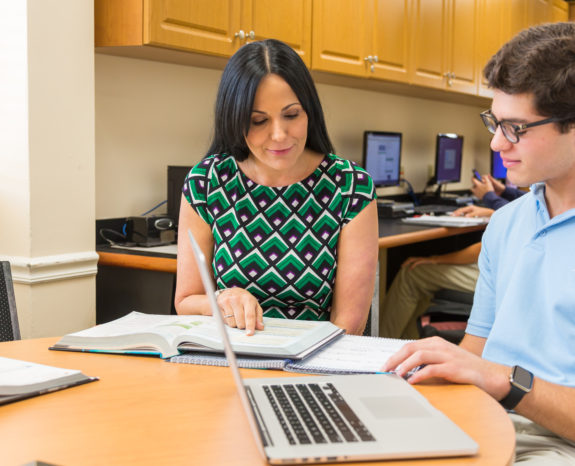 Guidance counselor advising a student.