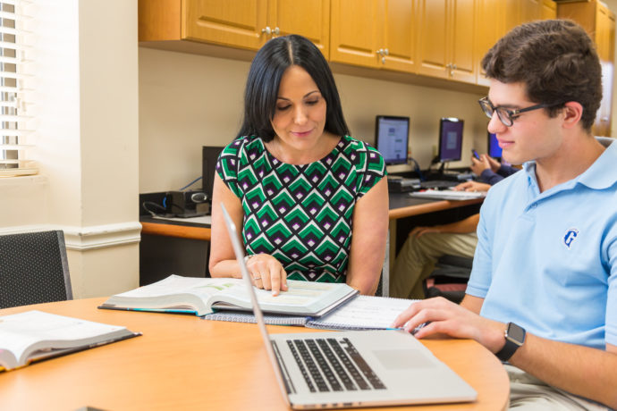 Guidance counselor advising a student.