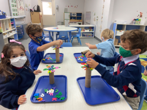 JK students began their study on trees, exploring and learning about different types of trees and even building their own "Chicka Chicka Boom Boom" trees.