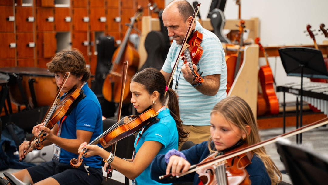 Middle School music teacher with students