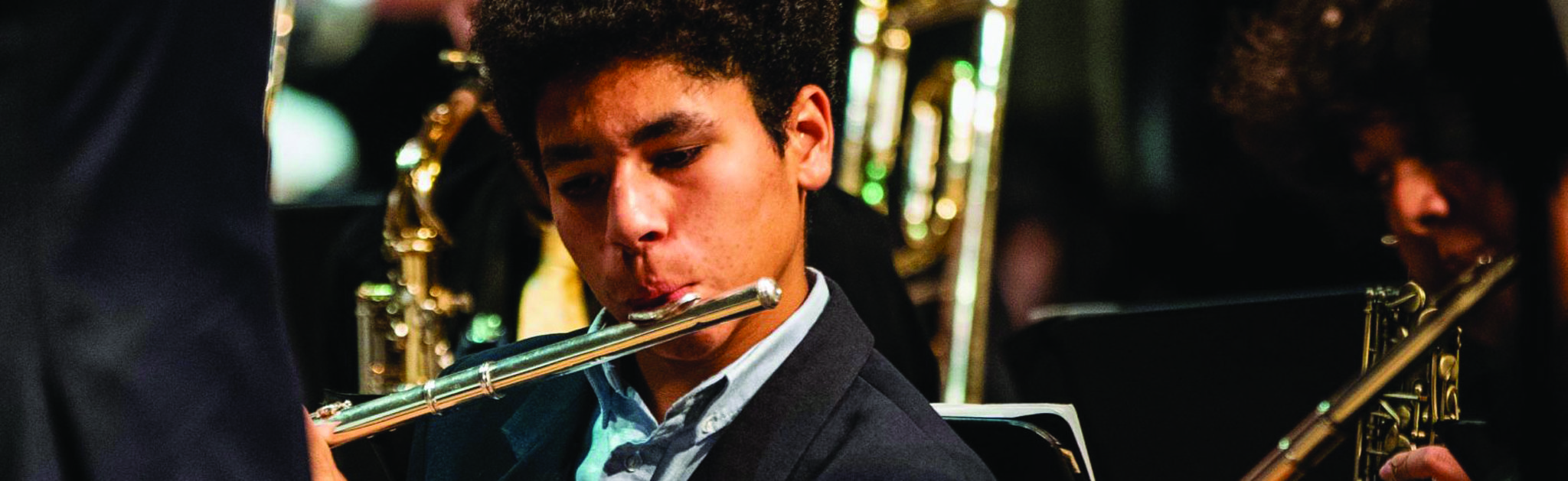 student playing a flute